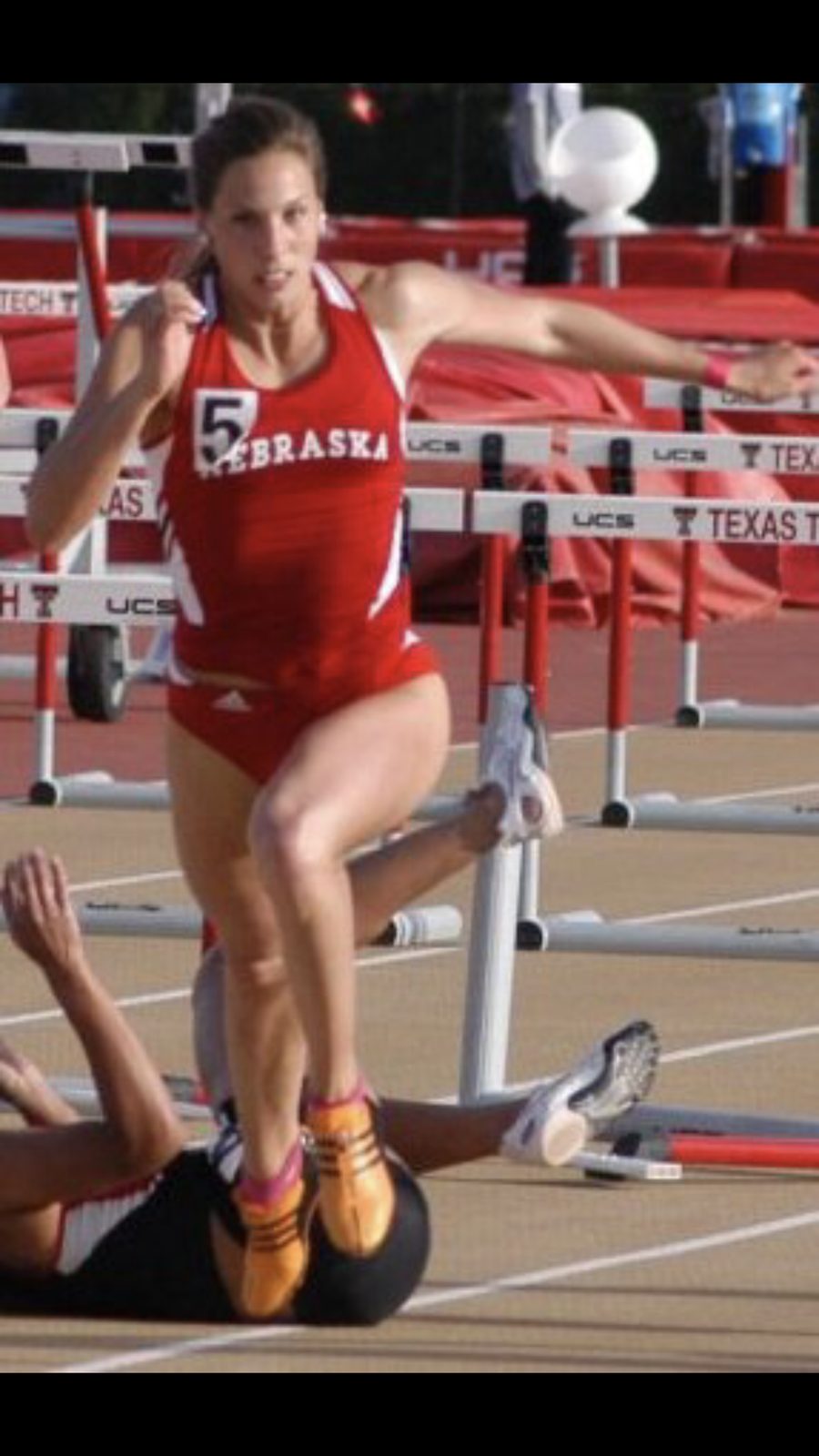 Arna Erega competing in the 100m hurdles for Nebraska